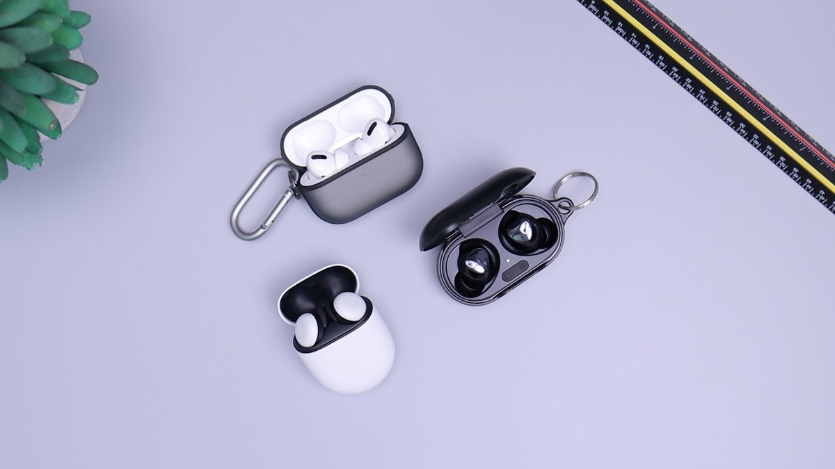 Wireless earbuds in charging cases on a lavender surface